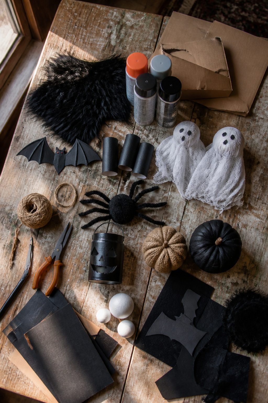 15 DIY Halloween Decorations for a Spooky 2026 16 Various Halloween decoration materials, including foam pumpkins and mason jars.