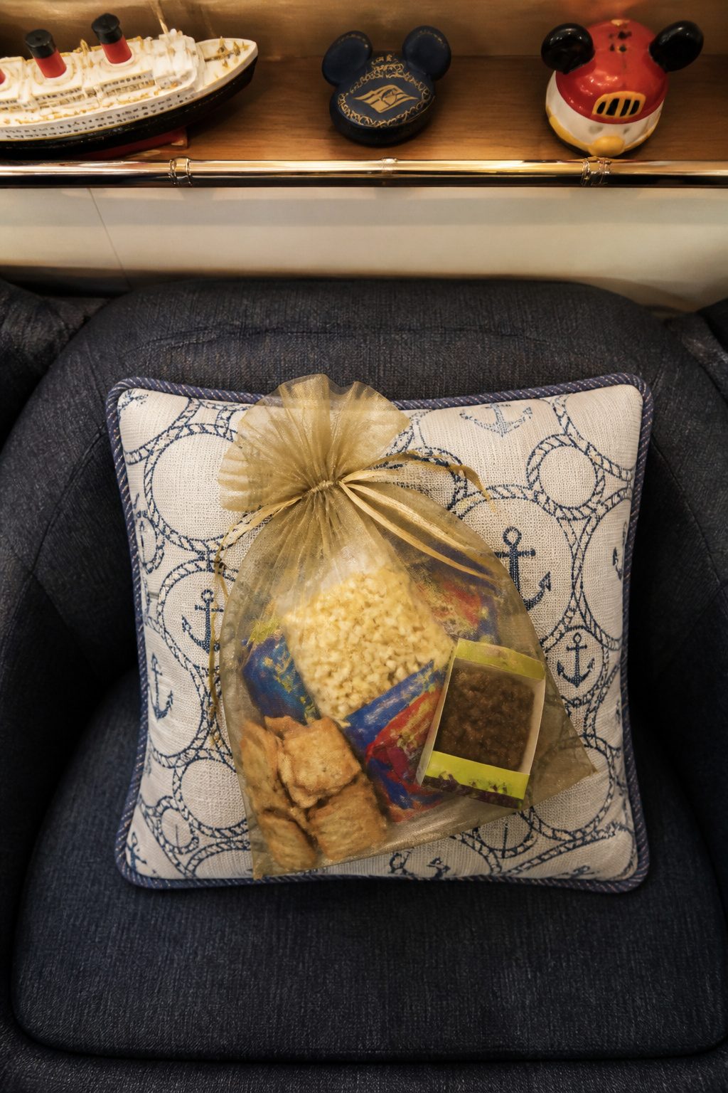 Fish Extender Gift Ideas for Disney Cruise Line (2026) 3 A bag filled with popcorn, crackers, and snacks for movie night.