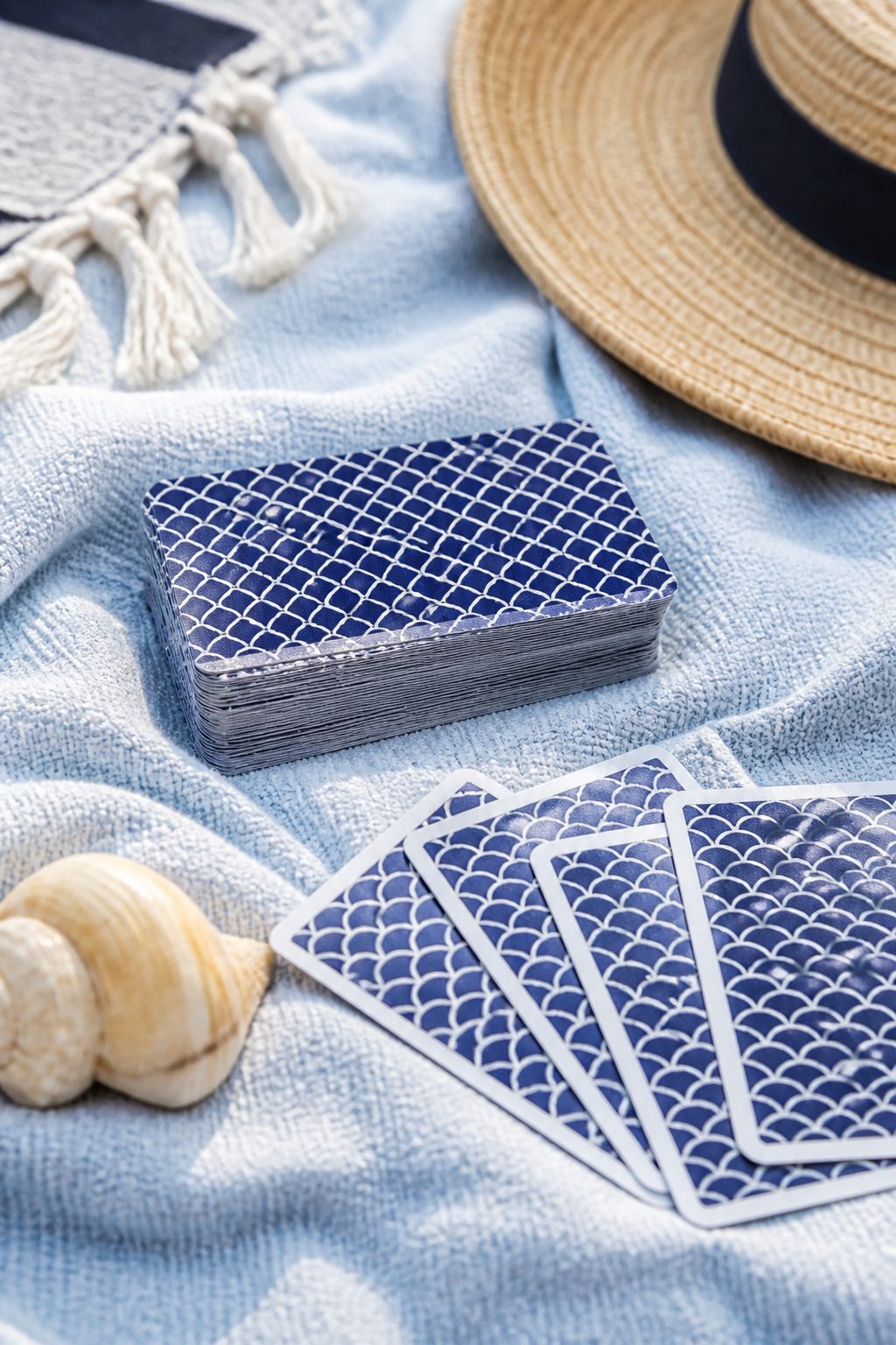 Fish Extender Gift Ideas for Disney Cruise Line (2026) 13 A deck of waterproof playing cards resting on a light fabric.
