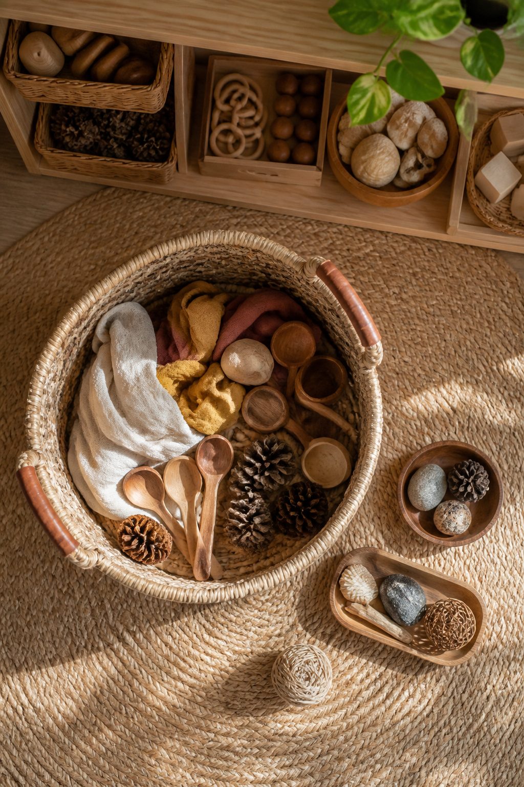 A low container filled with various everyday objects for toddlers.